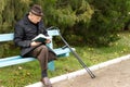 Senior amputee enjoying his book in the sunshine Royalty Free Stock Photo