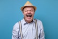 Senior angry and mad man screaming frustrated and furious, shouting with anger Royalty Free Stock Photo