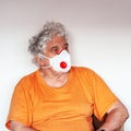 Senior with antiviral protective mask