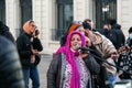 Senior Arab lady singing in a band of street musicians peforming in Marseilles, France