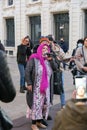 Senior Arab lady singing in a band of street musicians peforming in Marseilles, France