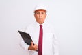 Senior architect man wearing security helmet holding clipboard over isolated white background with a confident expression on smart Royalty Free Stock Photo