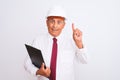 Senior architect man wearing security helmet holding clipboard over isolated white background surprised with an idea or question Royalty Free Stock Photo