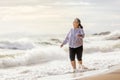 Senior Asia woman dancing on the beach