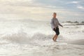 Senior Asia woman dancing on the beach