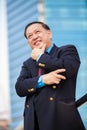Senior Asian businessman in suit smiling portrait