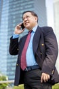 Senior Asian businessman using smart phone Royalty Free Stock Photo