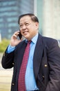 Senior Asian businessman using smart phone