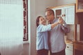 Senior asian couple dancing enjoying at home together,Having fun and love live forever Royalty Free Stock Photo