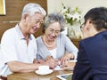 Senior asian couple signing a contract Royalty Free Stock Photo