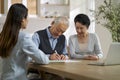 Senior asian couple signing a contract at home Royalty Free Stock Photo