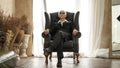 Senior Asian man handsome and suit sitting in rich expensive house Royalty Free Stock Photo