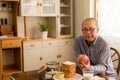Senior asian man hands holding red apple fresh fruit at home,Elderly healthy food concept