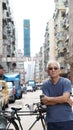 Senior asian man with hong kong urban architecture scene Royalty Free Stock Photo
