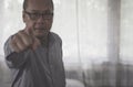 Senior asian man points his finger to you,Close up,Black and white toned,Selective focus Royalty Free Stock Photo