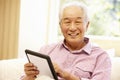 Senior Asian man using tablet Royalty Free Stock Photo