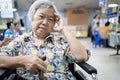 Senior asian patient in wheelchair waiting for a long time,medical examination with the doctor in the hospital,elderly people feel