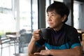 Senior Asian woman with coffee in cycling jersey Royalty Free Stock Photo