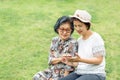 Senior asian woman with daughter relaxing on vacation together in mothers day