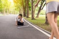 Senior asian woman with faint sitting on floor after falling down,female take care and support