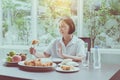 Senior asian woman feeling unhappy and bored meal,Elderly healthy concept Royalty Free Stock Photo