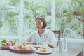 Senior asian woman feeling unhappy and bored meal,Elderly healthy concept Royalty Free Stock Photo