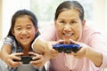 Senior Asian woman and girl playing video game Royalty Free Stock Photo