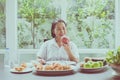 Senior asian woman hands holding apple fresh fruit at home,Elderly healthy food concept