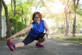 Senior asian woman stretch muscles at park Royalty Free Stock Photo