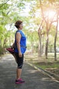 Senior asian woman stretch thigh muscles at park