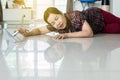 Senior Asian woman suffering with faint lying on floor after falling down stair at home Royalty Free Stock Photo