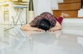 Senior Asian woman suffering with faint lying on floor after falling down stair at home Royalty Free Stock Photo