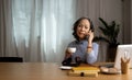 senior asian woman talk on cellphone discussing report using laptop computer. consultant advisor concept. Royalty Free Stock Photo