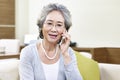 Senior asian woman talking on cellphone Royalty Free Stock Photo