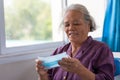 Senior asian woman wearing face mask during corona virus and flu outbreak. Disease and illness protection. the aging female Royalty Free Stock Photo