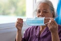 Senior asian woman wearing face mask during corona virus and flu outbreak. Disease and illness protection. the aging female Royalty Free Stock Photo