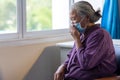 Senior asian woman wearing face mask during corona virus and flu outbreak. Disease and illness protection. the aging female Royalty Free Stock Photo