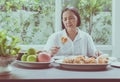 Senior asian woman feeling unhappy and bored meal,Elderly healthy concept