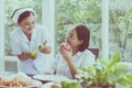 Senior asian woman hands holding apple fresh fruit at home,Nurse take care,Elderly healthy food concept Royalty Free Stock Photo