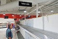 Senior Australian man looking at empty toilet rolls self in supermarket worried about the Coronavirus outbreak