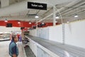 Senior Australian man looking at empty toilet rolls self in supermarket worried about the Coronavirus outbreak