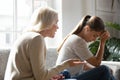 Senior mother talk scolding annoyed adult daughter at home