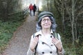 Senior backpacker following trail in nature Royalty Free Stock Photo