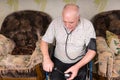 Senior Bald Man Checking his Blood Pressure Alone Royalty Free Stock Photo