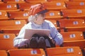 Senior Baseball fan taking statistics during game, Candlestick Park, San Francisco, CA Royalty Free Stock Photo