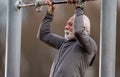 Senior man doing push ups at public gym Royalty Free Stock Photo