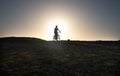 Senior biker riding bicycle on the cliff at sunset enjoying the healthy lifestyle Royalty Free Stock Photo