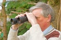 Senior with binoculars.