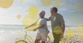 Senior biracial couple enjoys a sunny beach day, with copy space Royalty Free Stock Photo