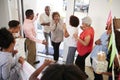 Senior African American couple arriving home to a family surprise party, elevated view